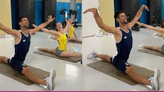 Novak Djokovic tập động tác xoạc chân cùng nhà vô địch thể dục dụng cụ thế giới Nina Derwael. (Ảnh: Twitter)