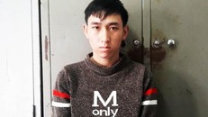 Đinh Mạnh Tài tại cơ quan điều tra. (Ảnh: báo Tiền Phong)