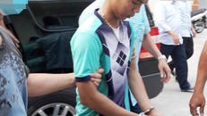 Nguyễn Hữu Tình khi bị dẫn giải về điều tra. Ảnh: CTV.