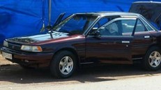 Chiếc xe của ông Hữu bị đặt mìn. Ảnh: Tiền Phong