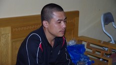 Trần Đình Thân tại cơ quan công an.