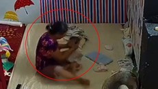 Nữ giúp việc đánh liên tục vào đầu và mông cháu bé vì không chịu uống sữa
