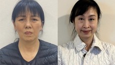 Bị can Nguyễn Thị Thanh Thủy (bên trái) và bị can Nguyễn Bạch Thùy Linh. 