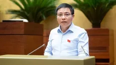 Thừa ủy quyền của Thủ tướng Chính phủ, Bộ trưởng Bộ Tài chính Nguyễn Văn Thắng đã trình bày Tờ trình về dự thảo Nghị quyết. Ảnh: QH