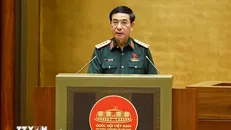 Bộ trưởng Bộ Quốc phòng Phan Văn Giang trình bày Tờ trình dự án các luật liên quan đến quốc phòng-an ninh. Ảnh: Doãn Tấn/TTXVN.