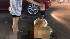 Hình ảnh nữ chủ tiệm spa bị làm nhục giữa phố