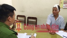 Cán bộ điều tra lấy lời khai Nguyễn Xuân Tiến. 