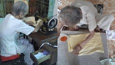 Mẹ Quýt tự tay cắt từng mảnh vải, tỉ mỉ từng mũi kim để may thành những chiếc khẩu trang. (Ảnh: Phương Hoa).