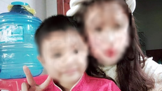 Bé Hồ Trần V.Đ. và chị gái.