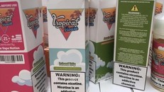 Những lọ tinh dầu thuốc lá điện tử nhập lậu bị cơ quan chức năng thu giữ.