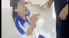 Nữ sinh bị đánh trong clip là học sinh Trường THCS Giang Biên (quận Hà Đông, Hà Nội). Ảnh: Chụp từ clip. 