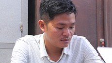 Nguyễn Hữu Tính tại cơ quan công an.