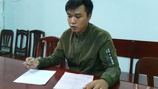 Phạm Minh Hậu tại cơ quan công an. - Ảnh: Báo Công An Nhân Dân