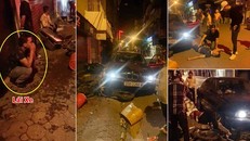 Tài xế thất thần, ngồi ôm mặt trên vỉa hè sau khi gây ra vụ tai nạn liên hoàn.