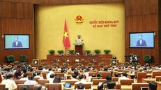 Bộ trưởng Bộ Công Thương Trần Tuấn Anh báo cáo trước Quốc hội (Ảnh: Doãn Tấn/TTXVN)