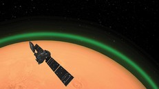 Đồ họa mô phỏng tàu quỹ đạo ExoMars và dải sáng xanh trên bầu khí quyển sao Hỏa. - Ảnh: ESA.