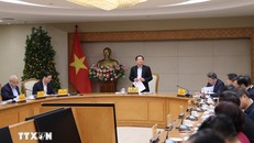 Phó Thủ tướng Hồ Quốc Dũng phát biểu tại cuộc họp.