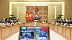 Thủ tướng Phạm Minh Chính chủ trì cuộc họp về xây dựng nhà cho nhân dân bị thiệt hại do bão lũ. Ảnh: Dương Giang/TTXVN.