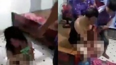 Hình ảnh thượng úy Thi cùng bà P. bị đánh ghen, lột sạch quần áo trước đó.