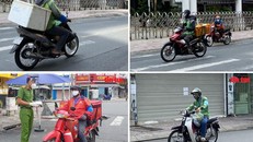 Shipper chạy trên đường để giao đồ cho người dân. Ảnh: Mạnh Linh/Báo Tin tức