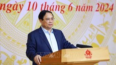 Thủ tướng Phạm Minh Chính chủ trì Hội nghị sơ kết 1 năm thực hiện tháo gỡ vướng mắc thực hiện Đề án 06. Ảnh: Dương Giang/TTXVN