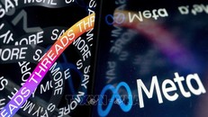 Biểu tượng công ty Meta và trang mở đầu của mạng xã hội Threads. Ảnh: AFP/TTXVN