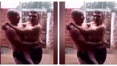 Xúc động video bố bế con tật nguyền tắm mưa