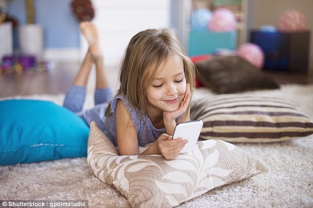 Parents should be given official advice warning them not to give their children smartphones before they reach secondary school, a leading psychiatrist has warned (file photo)