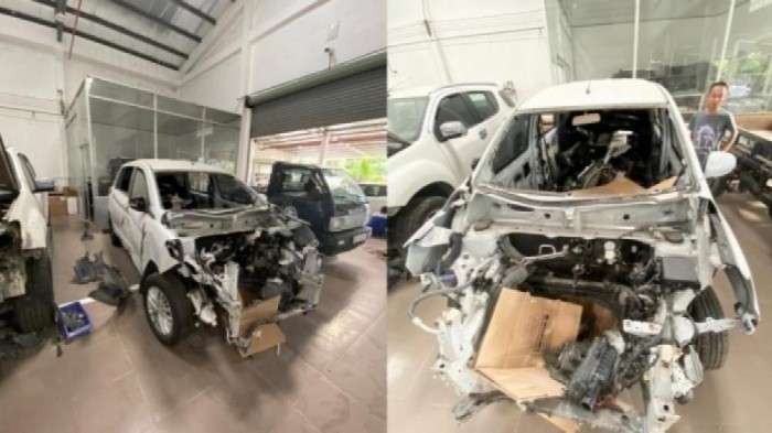 Suzuki Ertiga nằm tại gara chờ phụ tùng sửa chữa - 2