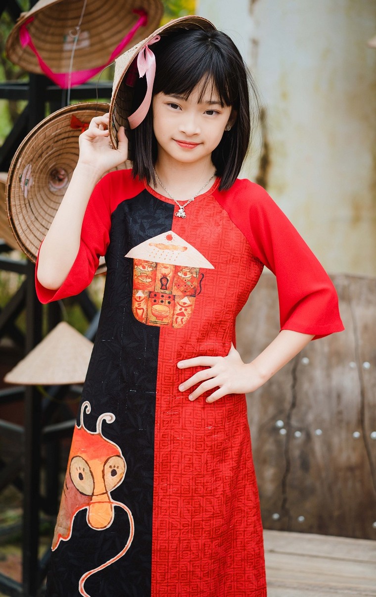 Vẻ đẹp thiên thần của em bé cổ động viên trận Việt Nam - Malaysia ảnh 5