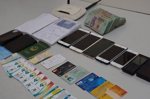 Hai nghi can trong đường dây lừa đảo cước điện thoại bị bắt ảnh 2