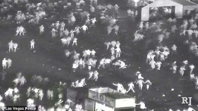 The camera atop the hotel bears silent witness as floodlights sweep the concert crowd before the shooting starts; follows the massacre as bright lights come up and people flee; and shows small groups huddled over apparently injured victims