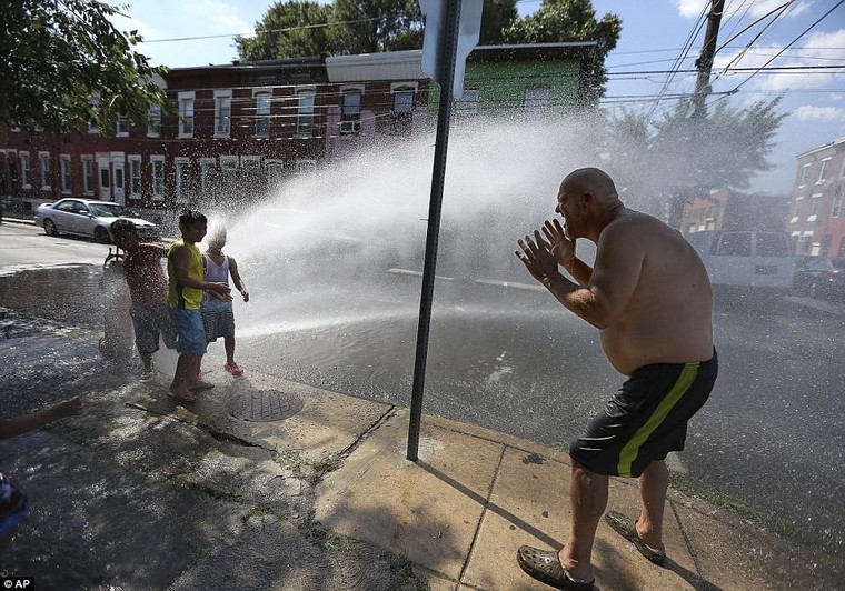 Those who plan to spend time outdoors are advised to stay hydrated and limit intake of alcoholic beverages, regardless of their health and physical activity.Â&nbsp;Al Slaughter, 58, joins neighborhood children as he tries to cool off under the fire hydrant in Philadelphia