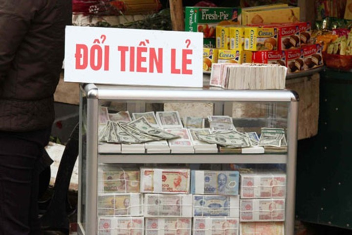 Loạn phí đổi tiền lẻ dịp Tết Nguyên đán 2016 ảnh 1