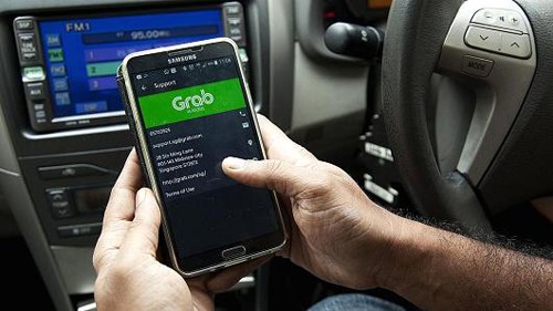 Grab sẽ "một mình một ngựa" khi không còn đối thủ trực tiếp Uber. Ảnh: CNB