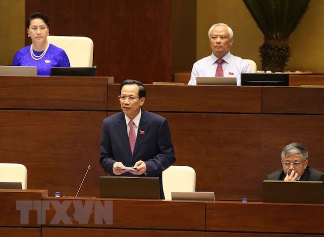 Bộ trưởng Bộ Lao động, Thương binh và Xã hội Đào Ngọc Dung trả lời chất vấn. (Ảnh: Doãn Tấn/TTXVN)