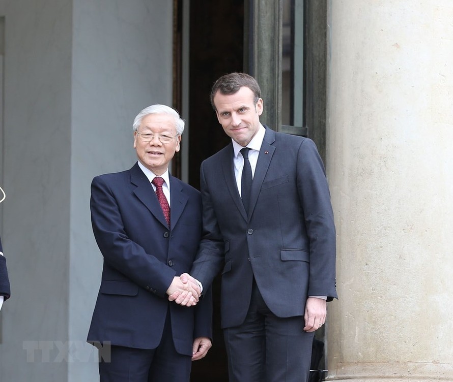 Tổng Bí thư Nguyễn Phú Trọng và Tổng thống Emmanuel Macron. Ảnh: TTXVN