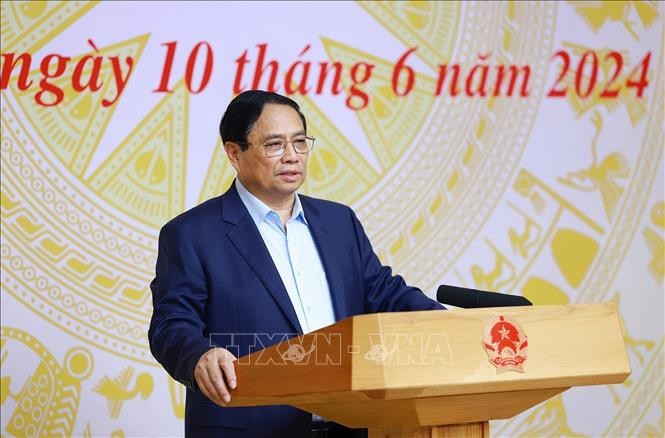 Thủ tướng Phạm Minh Chính chủ trì Hội nghị sơ kết 1 năm thực hiện tháo gỡ vướng mắc thực hiện Đề án 06. Ảnh: Dương Giang/TTXVN