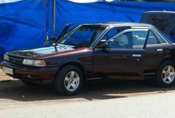 Chiếc xe của ông Hữu bị đặt mìn. Ảnh: Tiền Phong