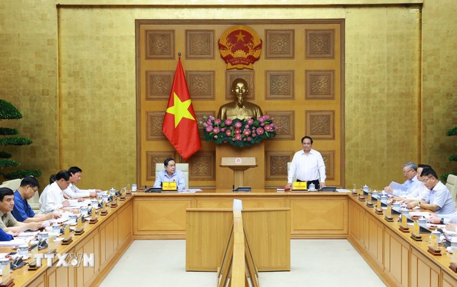 Cuộc họp giữa Đảng ủy Chính phủ và Đảng ủy Quốc hội nhằm chuẩn bị cho Kỳ họp thứ 10, Quốc hội khóa XV. Ảnh: Dương Giang/TTXVN.