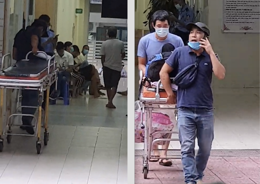 Đối tượng cò mồi của xe cấp cứu dù ngang nhiên hoạt động trước mặt lực lượng bảo vệ của bệnh viện Việt Đức (Ảnh cắt từ clip ghi lại của PV)