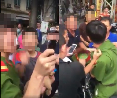 Chiến sỹ công an nghĩa vụ bị đám đông bao vây.