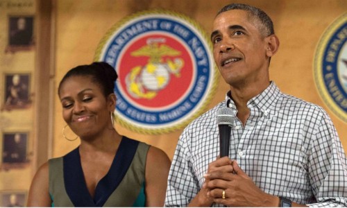 Vợ chồng tổng thống Obama. Ảnh: AFP