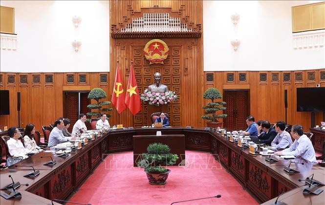 Thủ tướng Phạm Minh Chính chủ trì cuộc họp về đảm bảo cân bằng thương mại với Hoa Kỳ. Ảnh: Dương Giang/TTXVN.