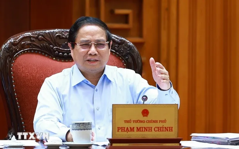 Thủ tướng Phạm Minh Chính chủ trì họp Thường trực Chính phủ với các bộ, ngành và Đoàn đàm phán Chính phủ về các vấn đề thương mại với Hoa Kỳ. Ảnh: Dương Giang/TTXVN.