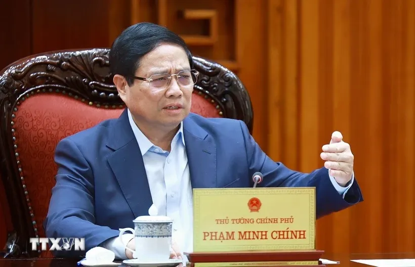 Thủ tướng Phạm Minh Chính chủ trì cuộc họp về mức áp thuế mới của Hoa Kỳ đối với hàng hóa nhập khẩu từ Việt Nam. Ảnh: Dương Giang/TTXVN