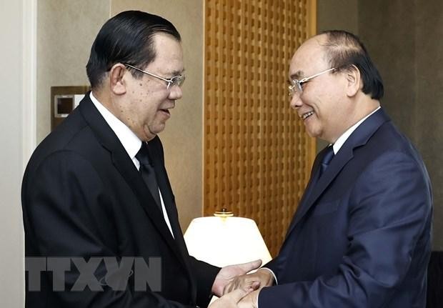 Chủ tịch nước Nguyễn Xuân Phúc gặp Thủ tướng Campuchia Samdech Techno Hun Sen. (Ảnh: Thống Nhất/TTXVN)